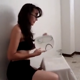 A brunette woman wearing glasses appears to be preparing a dinner by taking a massive, heaping shit on a plate and pissing into a glass. About 3 minutes.
